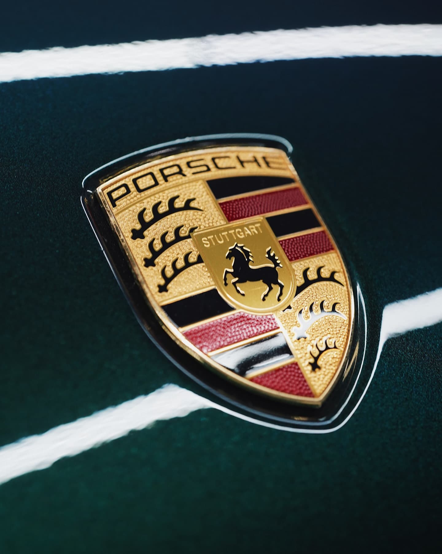 Porsche crest on a freshly wrapped panel